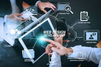 istockphoto-1371339413-612×612 Developing programming and coding technologies with Website design in virtual diagram.co working team meeting concept,businessman using smart phone and digital tablet and laptop computer and name tag in modern office